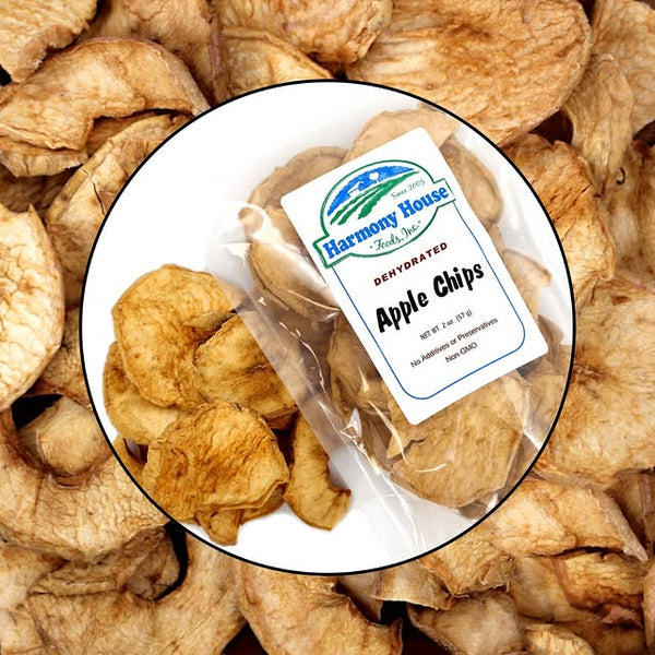 Harmony House brand denatured apple chips packaging surrounded by apple chips.